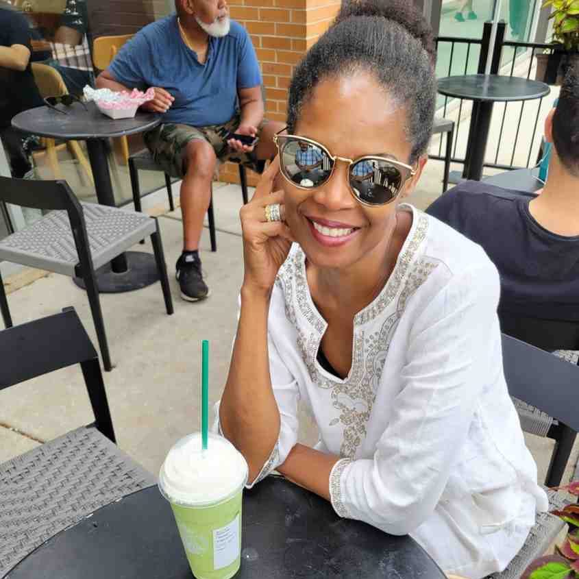 woman smiling with mirror glasses
