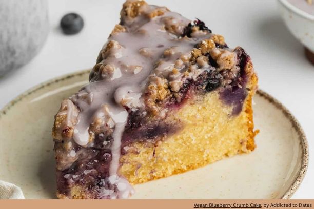 A moist blueberry coffee cake with a blueberry colored glaze