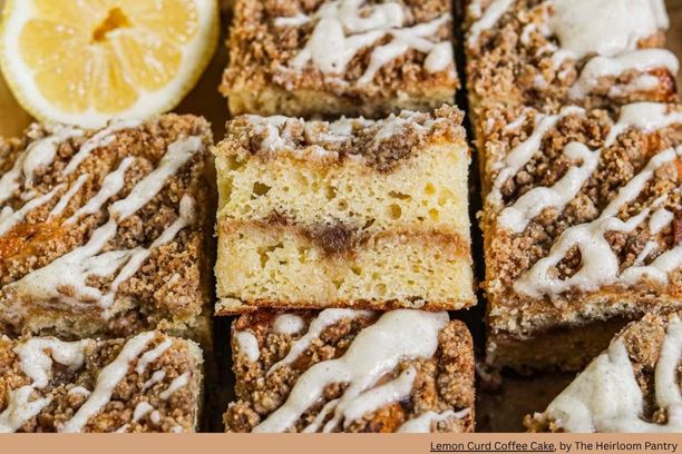 squares of lemon coffee cake with half a lemon