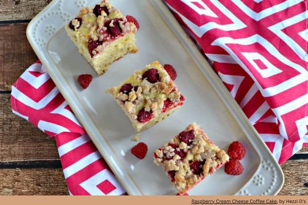2 squares of raspberry coffee cake on an elongated dish