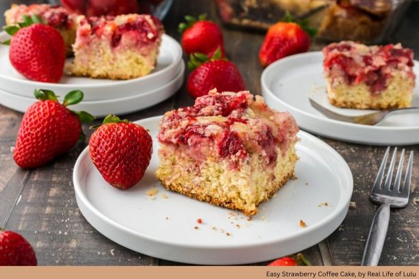 A piece of cake topped with strawberries on a plate